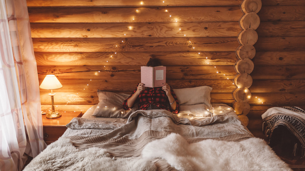 Woman reading in bed