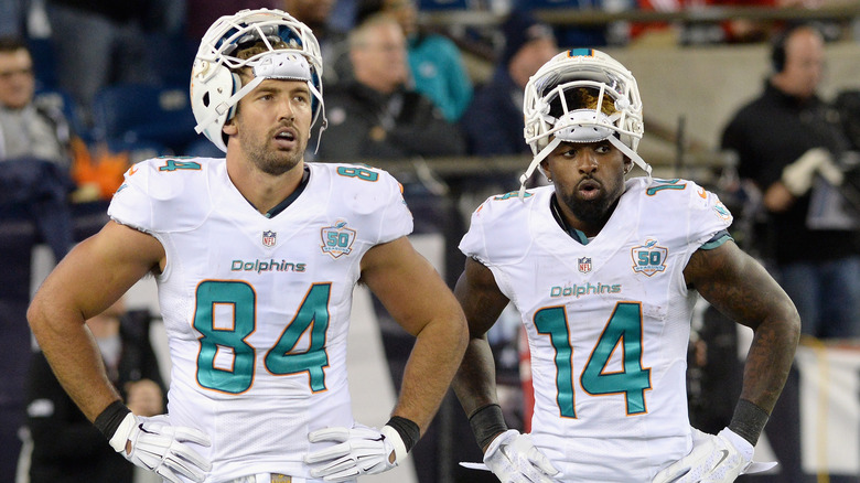 Jordan Cameron and a teammate in football gear