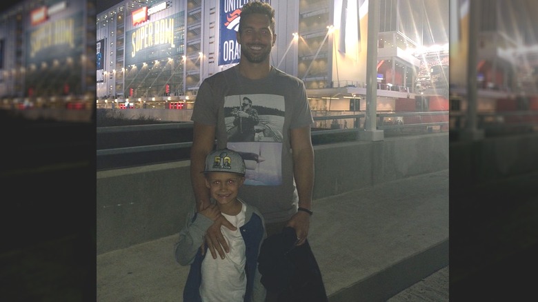 Jordan Cameron posing with his son