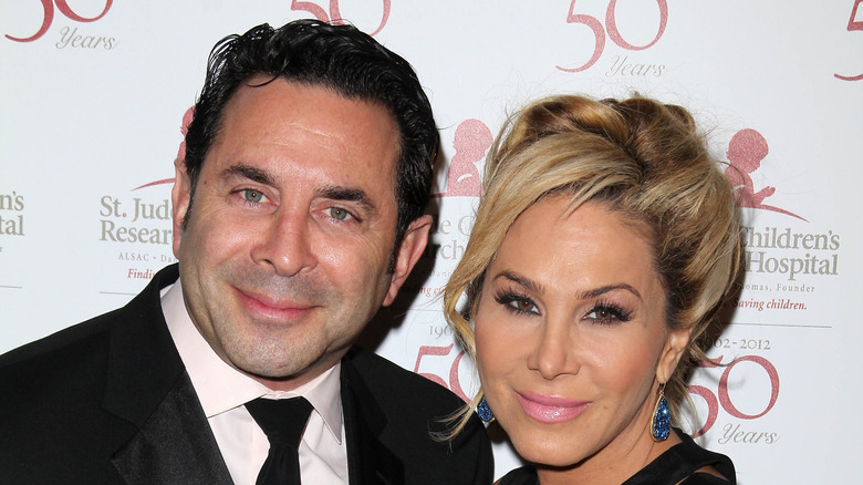 Adrienne Maloof and Paul Nassif pose at an event