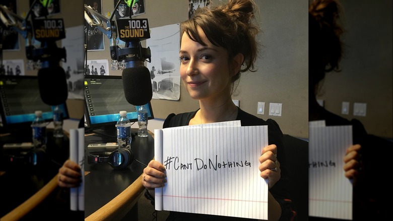 Milana Vayntrub holding up legal pad with #cantdonothing written on it