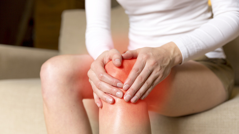 Woman with knee pain and inflammation