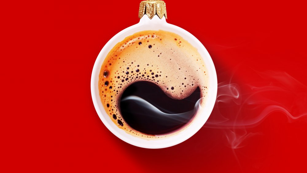 hot cup of coffee with a bold red background 