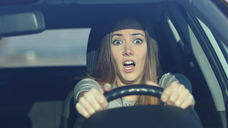 scared woman driving before crash