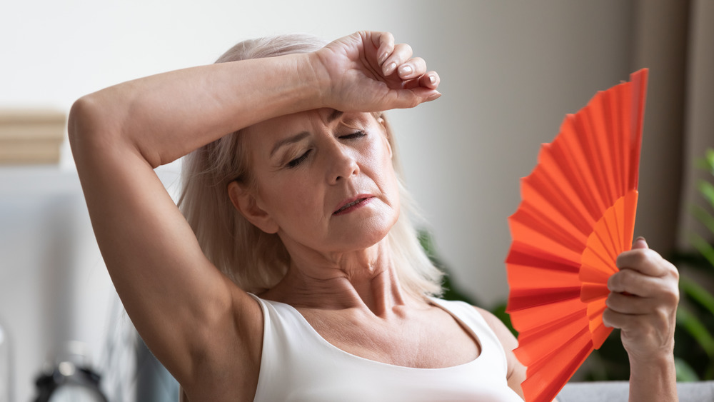 Woman fanning herself