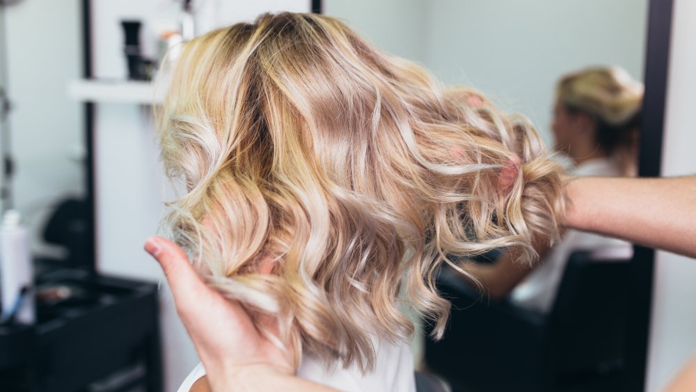 blonde woman with mid-length hair at the salon