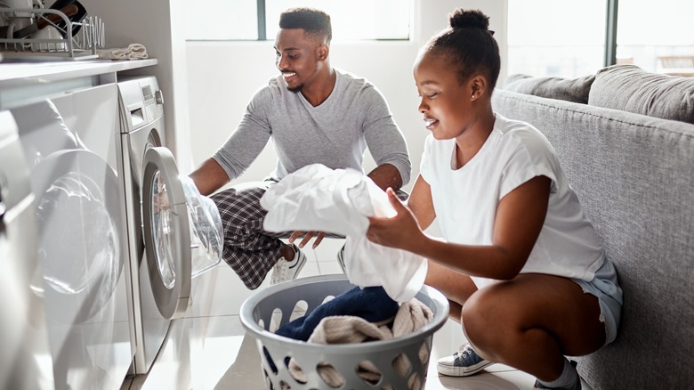 Couple doing laundry together 