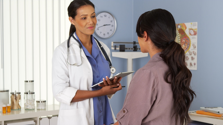 woman talking to doctor