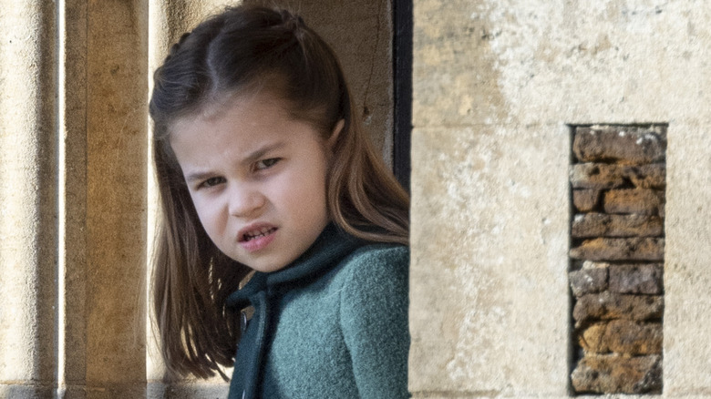 Princess Charlotte looking out from a doorway