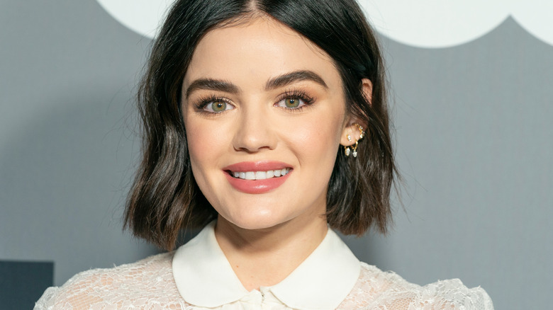 Lucy Hale smiling on red carpet