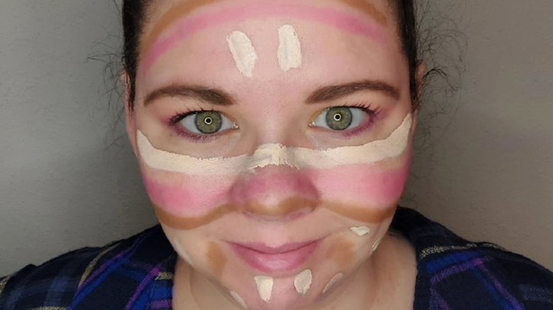 Woman wearing products for rainbow contouring