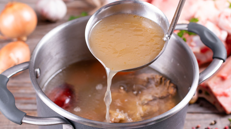 A saucepan full of homemade chicken broth