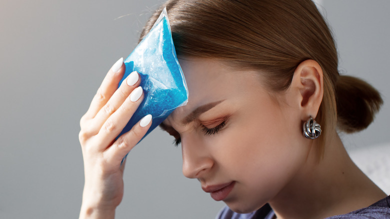 woman with ice pack on head