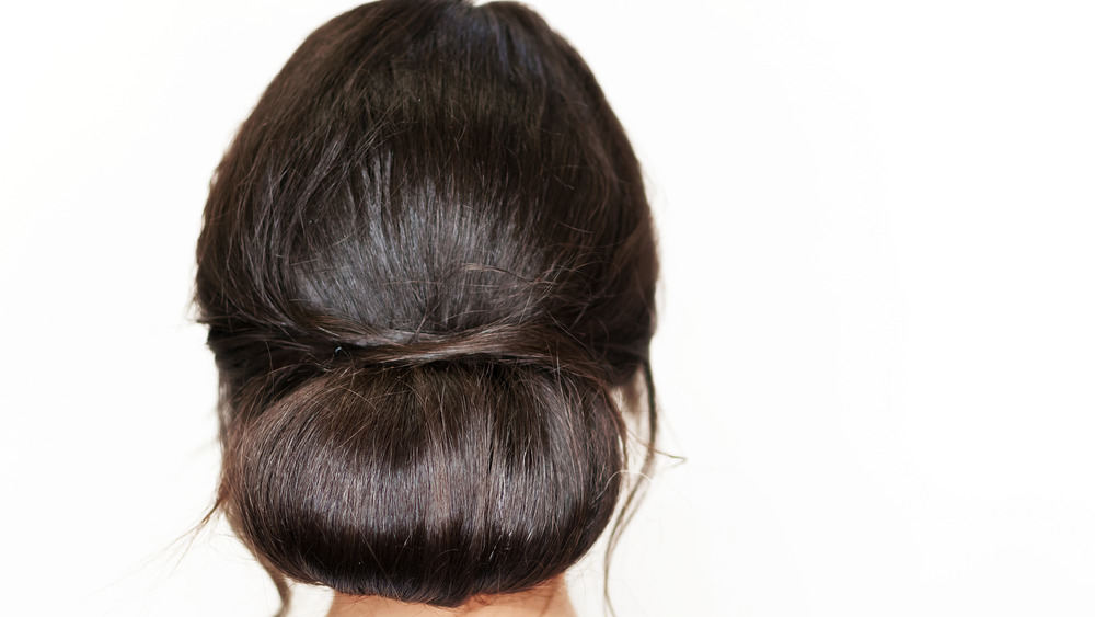 A simple chignon with brunette hair