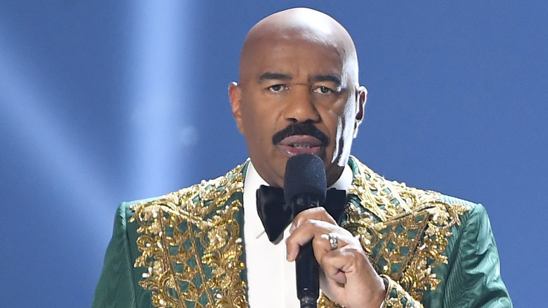 Steve Harvey talking into microphone