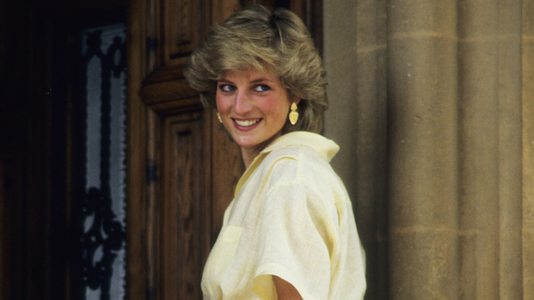 Princess Diana smiling over her shoulder 