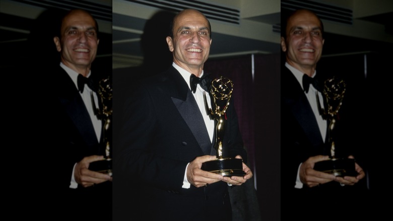 Thom Christopher holding his Emmy