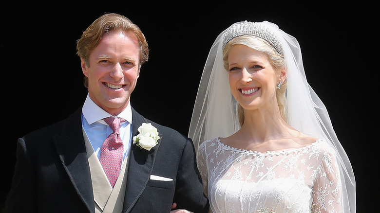 Thomas Kingston and Lady Gabriella Kingston arm-in-arm at their wedding