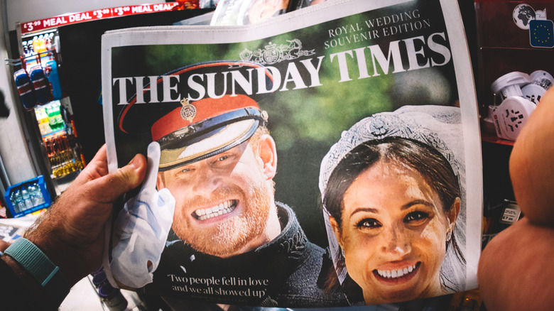 A newspaper cover of Harry and Meghan