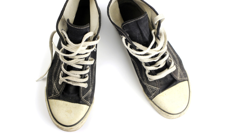 top view of worn-out canvas sneakers