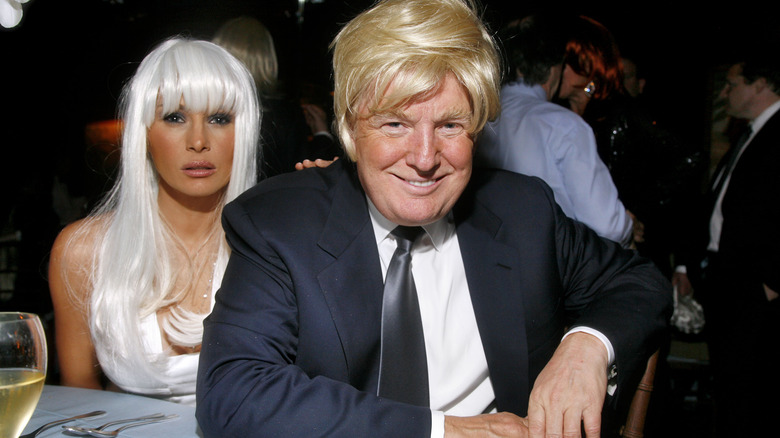 Donald Trump and Melania Trump wearing wigs at a party