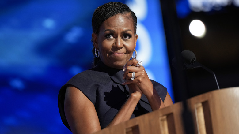 Michelle Obama hands clasped on stage