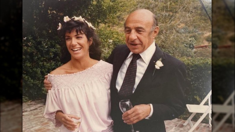 Hilary Farr smiling with her dad on her wedding day