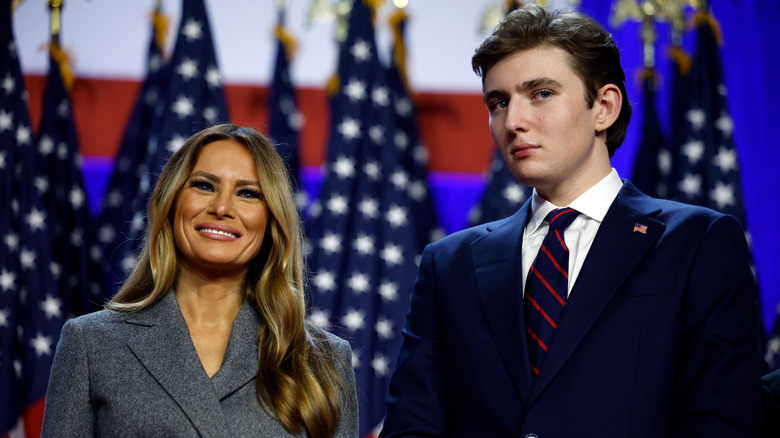 Melania Trump and Barron Trump stand next to each other