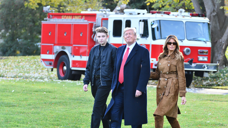 Barron, Donald, and Melania Trump take a walk together