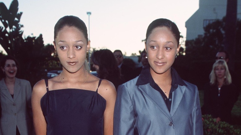 Tia and Tamera Mowry posing