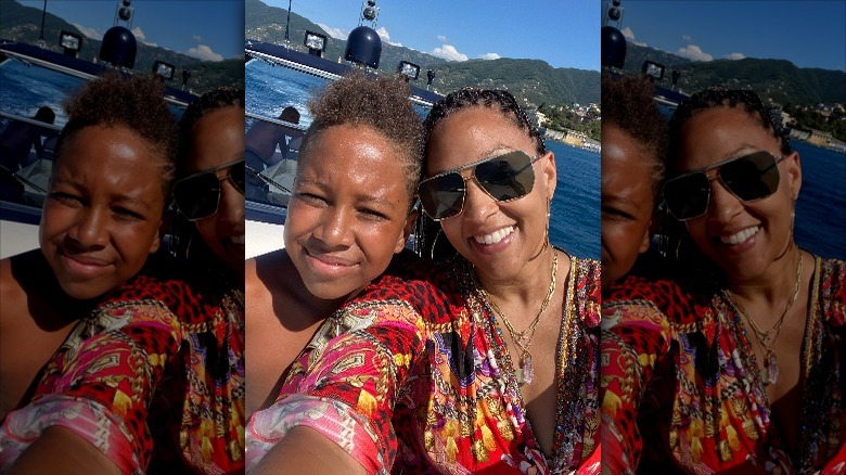 Tia Mowry taking a selfie on a boat with her son Cree