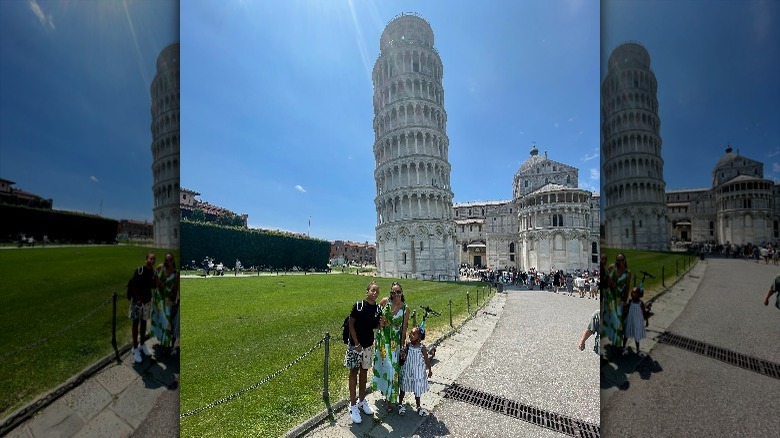 Tia Mowry posing in front of Leaning Tower of Pisa with her children