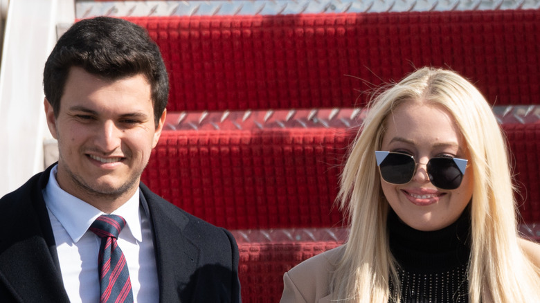 Tiffany Trump and Michael Boulos descend Air Force One