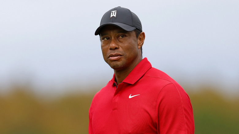 Tiger Woods looking serious at a golf tournament