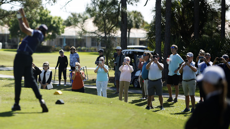 Charlie Woods with a lot of spectators