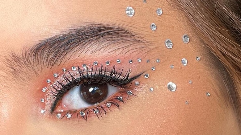 "Euphoria"-inspired makeup look with rhinestones