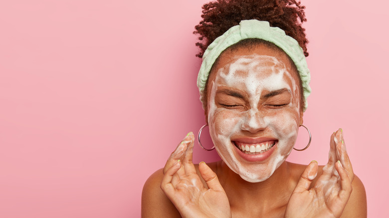 Woman washing face