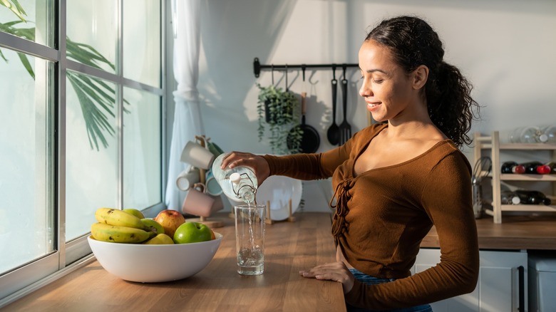 woman pouring water