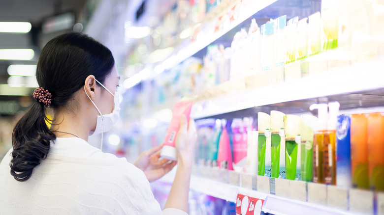 Woman shopping for drugstore beauty