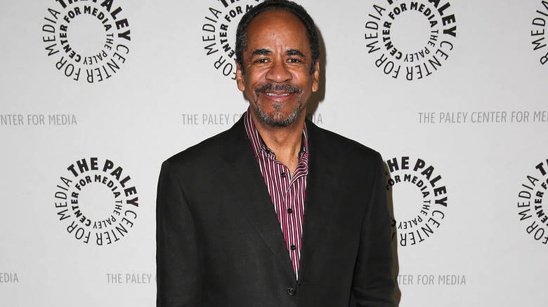 Tim Reid smiling for press