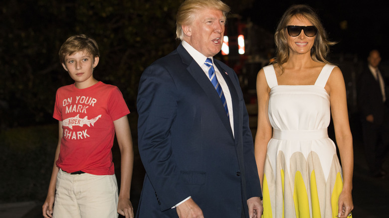 Barron, Donald, and Melania Trump look at cameras