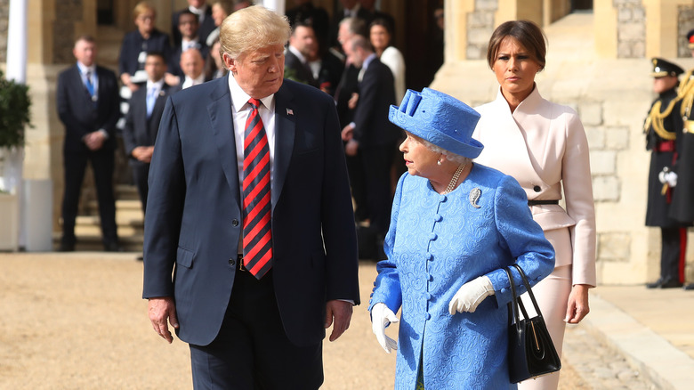 Queen Elizabeth and Donald Trump walking and talking