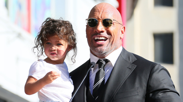 Dwayne Johnson and daughter Jasmine Johnson attend a ceremony honoring him with a star on The Hollywood Walk of Fame in Los Angeles. (2017)