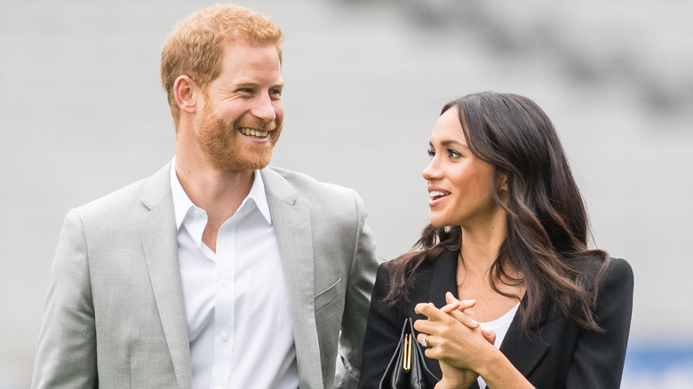 Prince Harry and Meghan Markle smiling