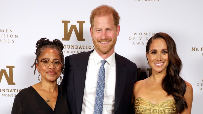 Doria Ragland, Prince Harry, and Meghan Markle smiling