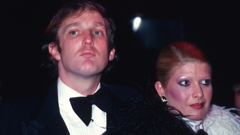Young Donald Trump and Ivana Trump stand side by side