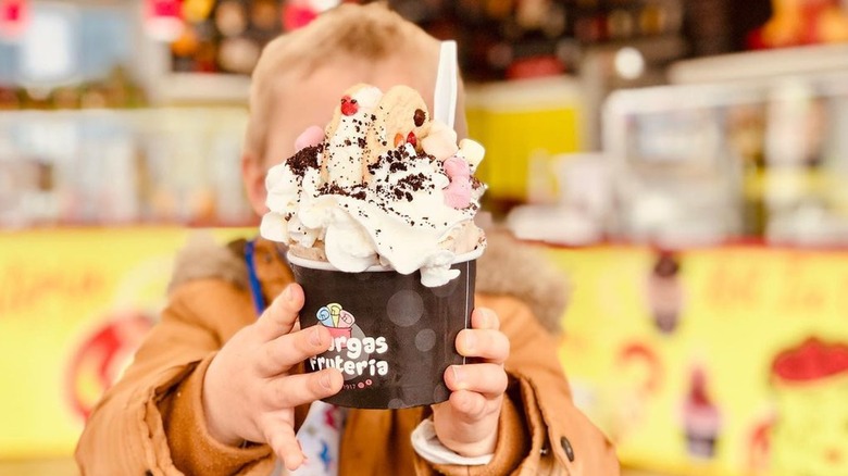 Samuel Dillard holding ice cream sundae