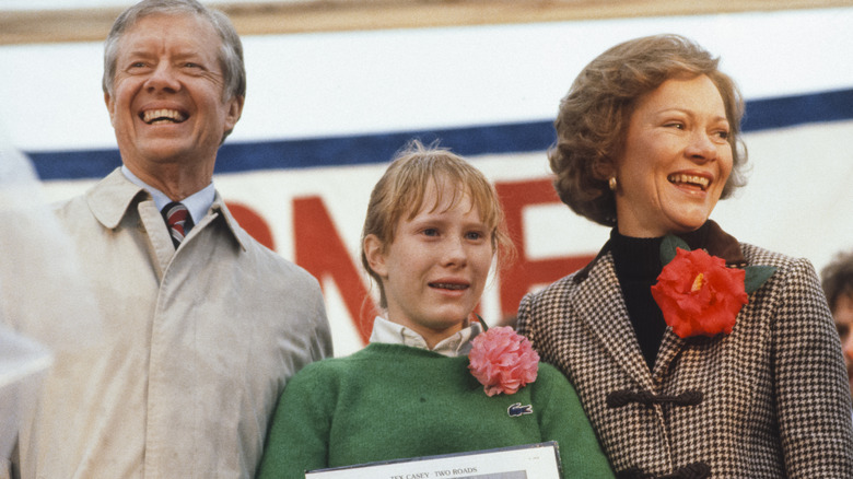 Jimmy Carter stands onstage with wife Rosalynn and daughter Amy at an event in Georgia in January 1981