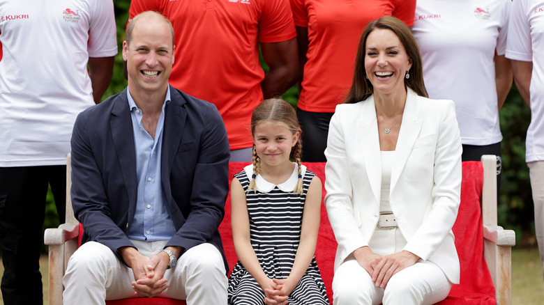 Prince William and Kate Middleton smile with Charlotte