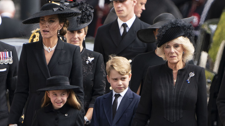 The royal family dressed in black 